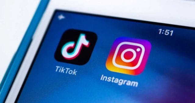 The tiktok and instagram logos are displayed on a cell phone.