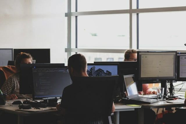 Unlocking Business Growth In The Philippines: Benefits Of Outsourcing To A Digital Agency | Lime Digital Asia people sitting on chair in front of computer monitor