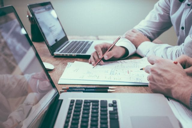How To Choose The Best SEO Services For Your Business | Lime Digital Asia person holding pencil near laptop computer