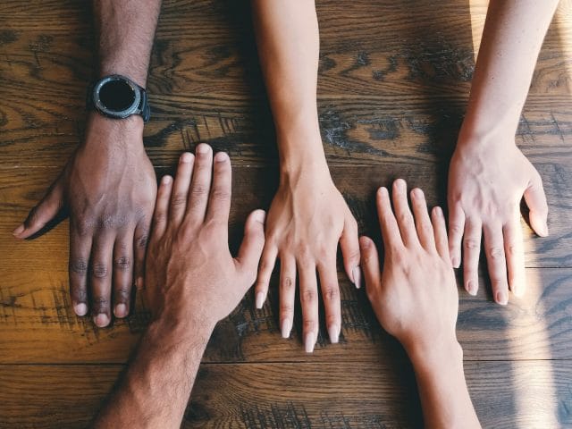 Navigating the Filipino Social Media Scene: Discovering the Best Social Media Platform for Your Brand | Lime Digital Asia five human hands on brown surface
