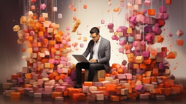 A businessman sitting on a box in front of colorful cubes.